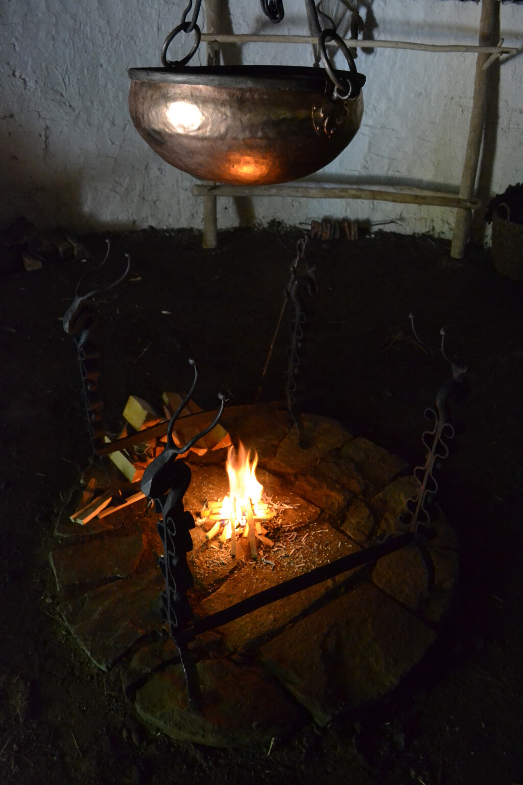 An image of the cauldron hanging above the fire