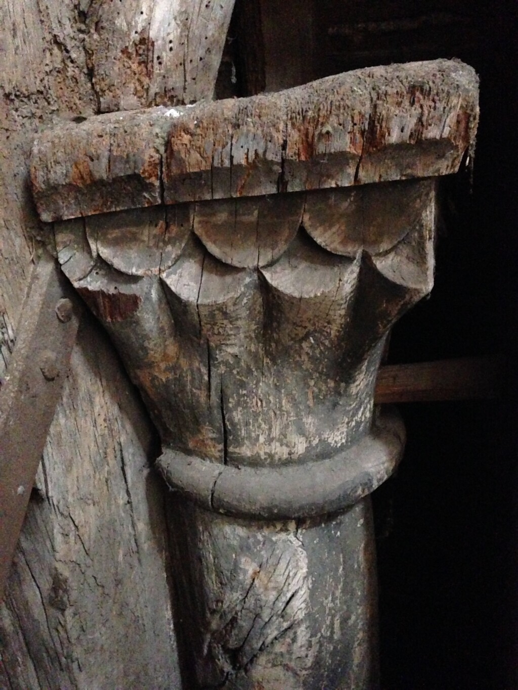 A carved wooden capital