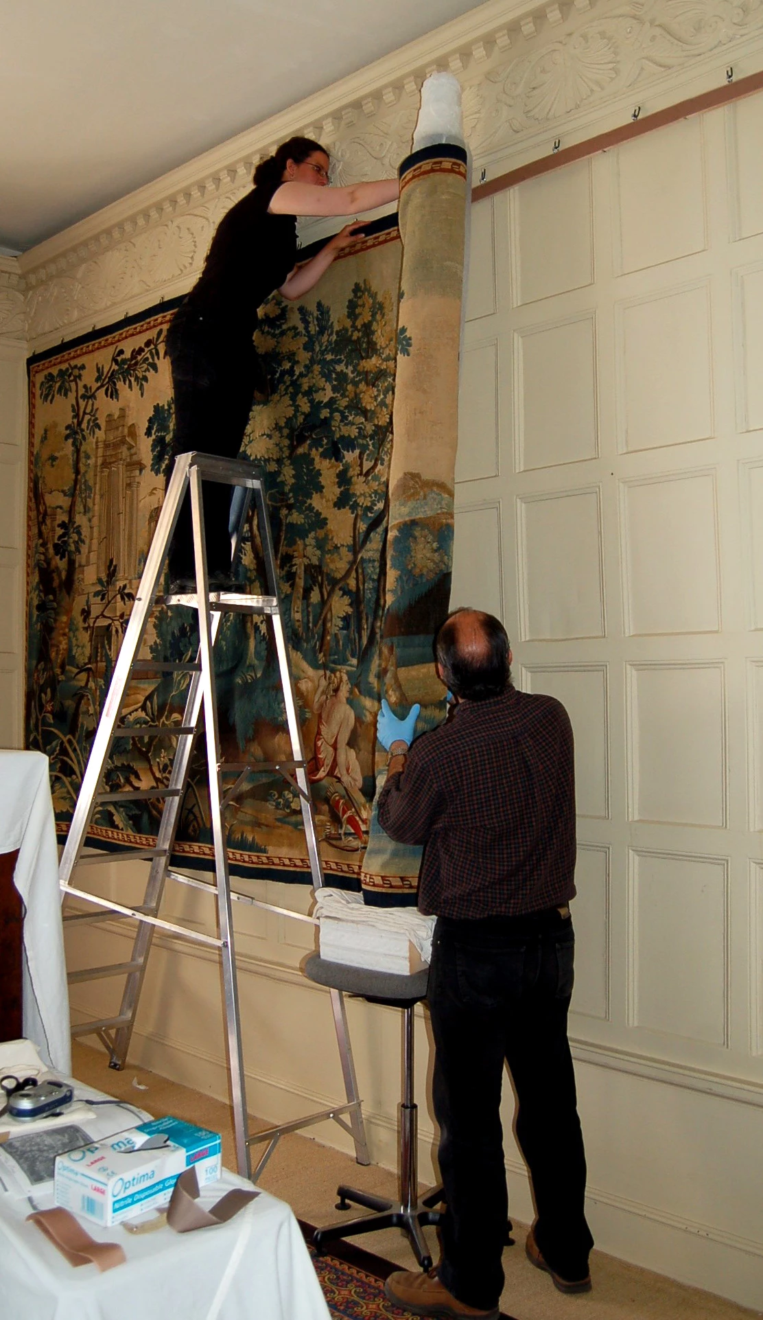 textile conservators at work