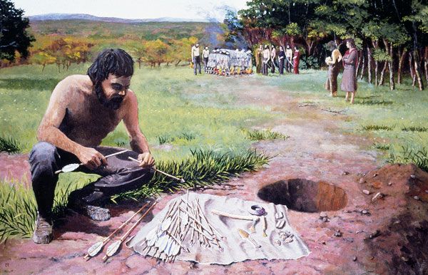 The preparation of a Bronze Age archer's grave, based on finds from the round barrow at Breach Down at Breach Farm, Llanblethian, The Vale of Glamorgan about 2,000-1,500 BC; by Paul Jenkins, about 1980.