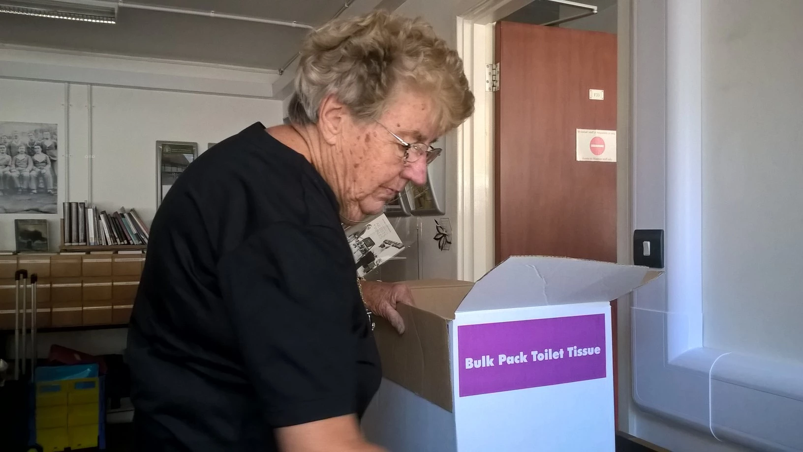 Barbara cataloguing books from the Oakdale Library.
