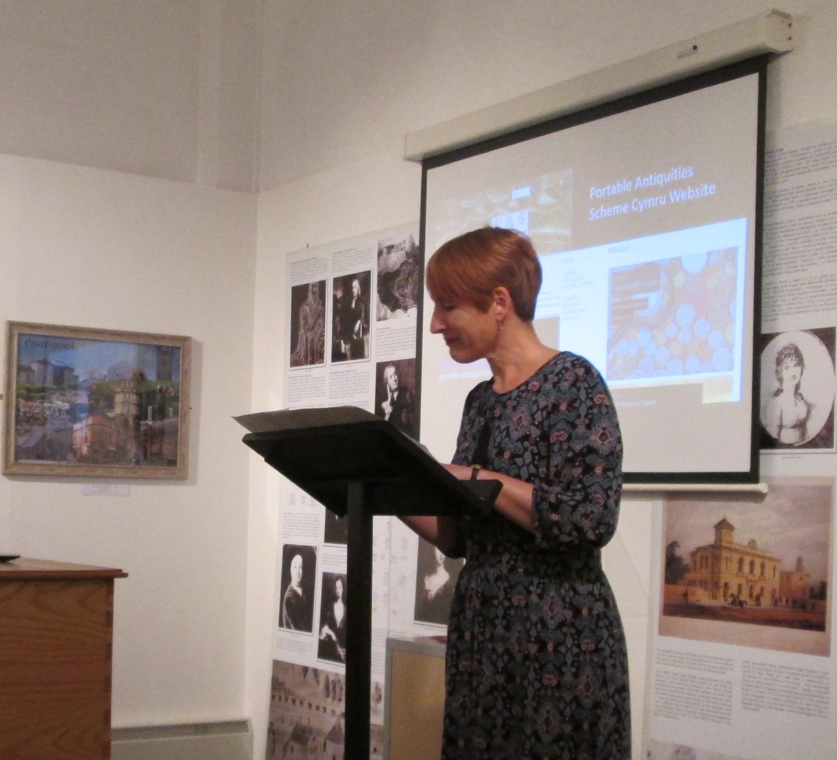 Rhianydd Biebrach, who is the project officer of the Saving Treasures Telling Stories project at the National Museum Wales, is giving a presentation about the project.