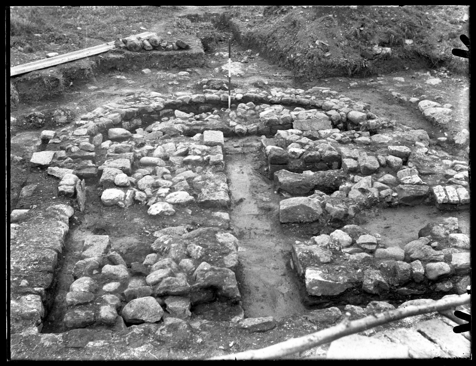 Black and white photograph of excavations