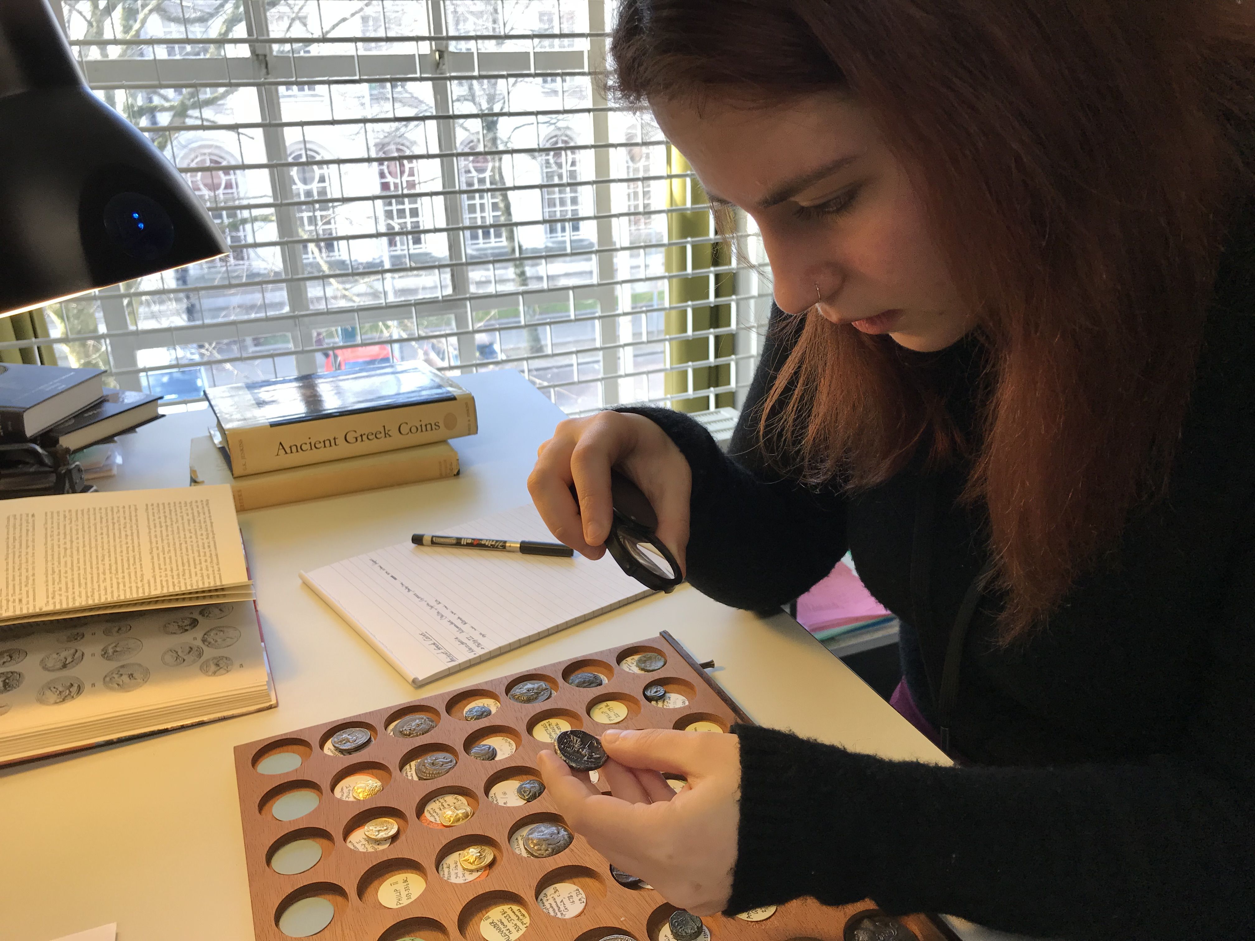 Eirini student work placement studying ancient coins