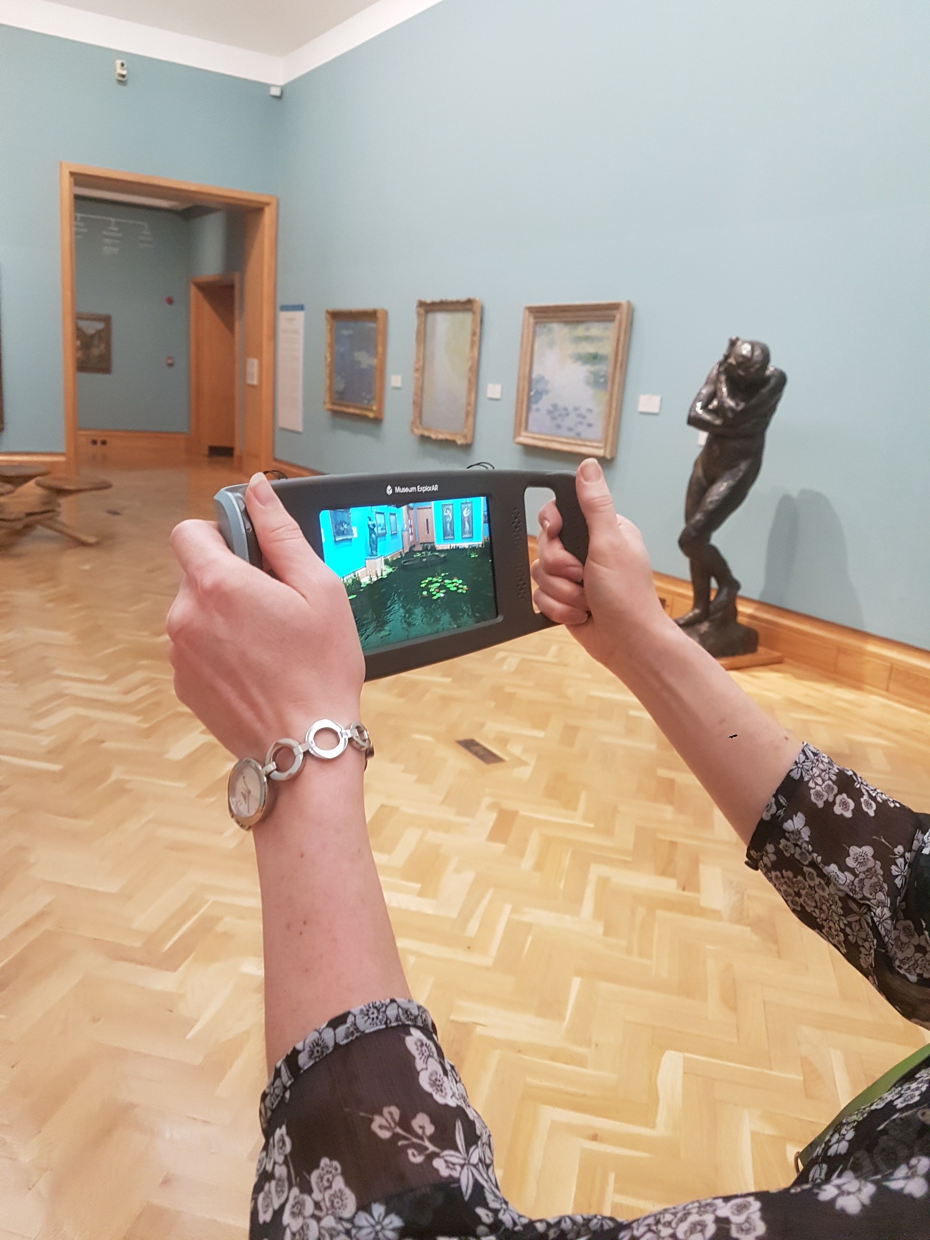 View of device in the gallery showing augmented reality on the screen