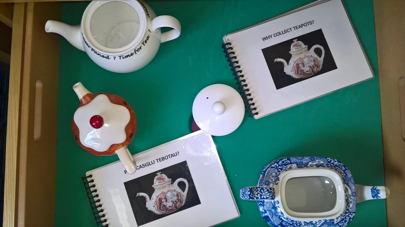 photo of a drawer of teapots used for handling and education