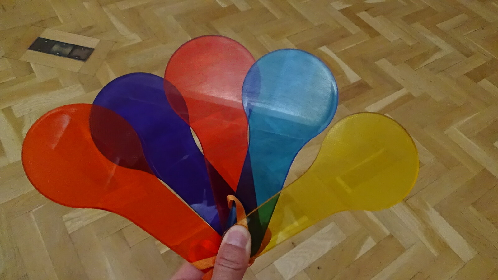 photograph of 5 paddle shaped plastic colour filters