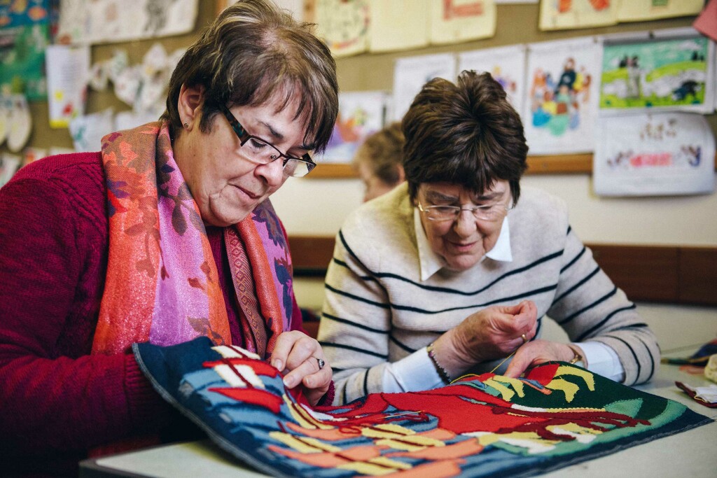 Volunteers sewing and artwork