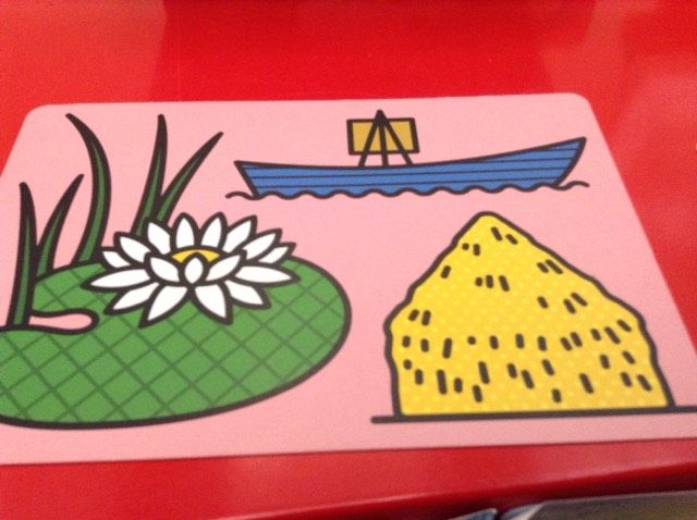 photo of a crad from the Guess the Artist game. It shows illustrations of a haystack, a lilypad and a boat with an easel