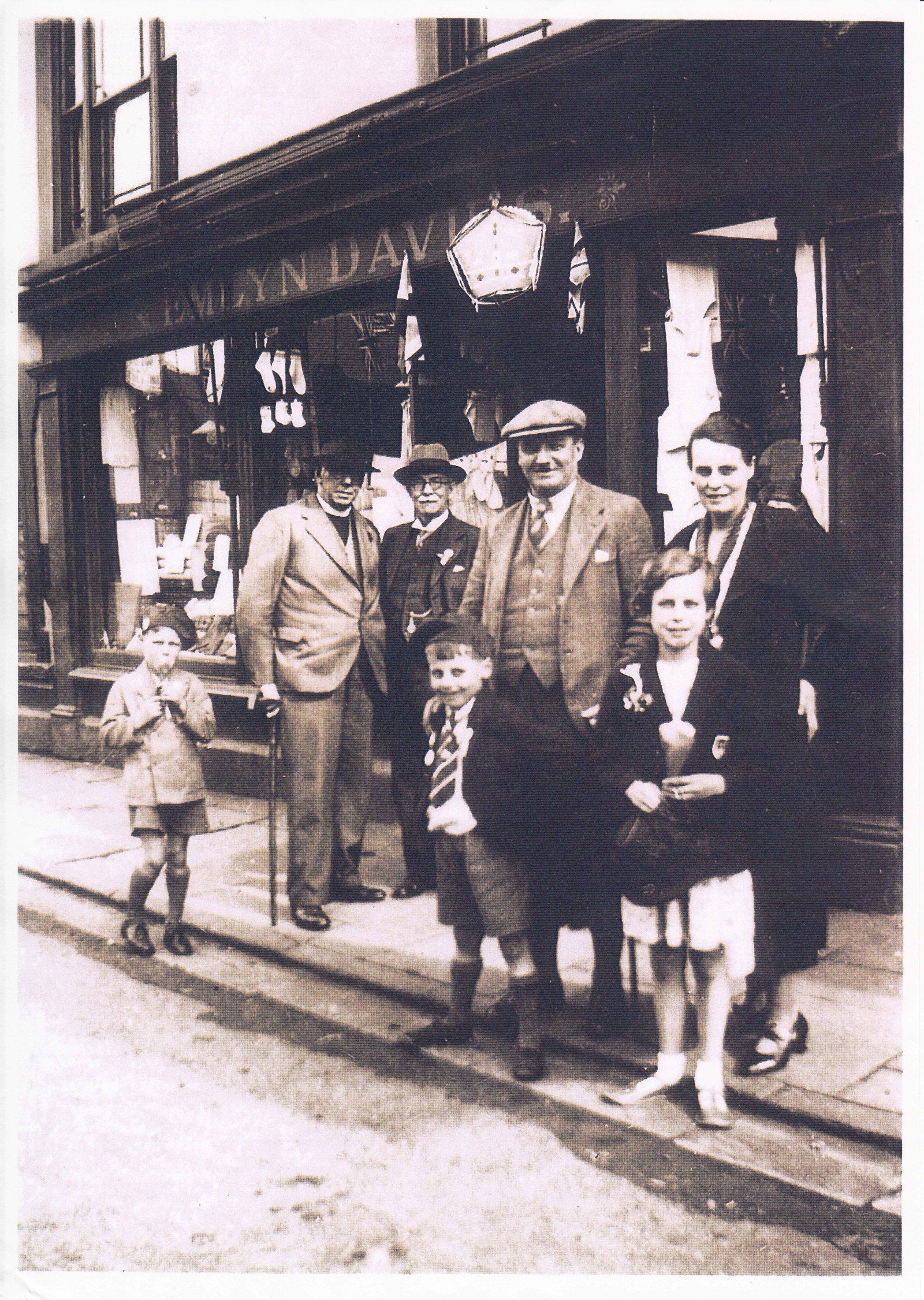 Emlyn Davies outside his shop with friends and family Coronation Day 12th May, 1937