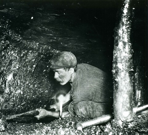 Collier undercutting a coal face c.1900