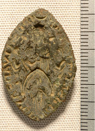Seal from St Nicholas, showing Virgin and Child and praying cleric under a canopy at her feet (13th century).