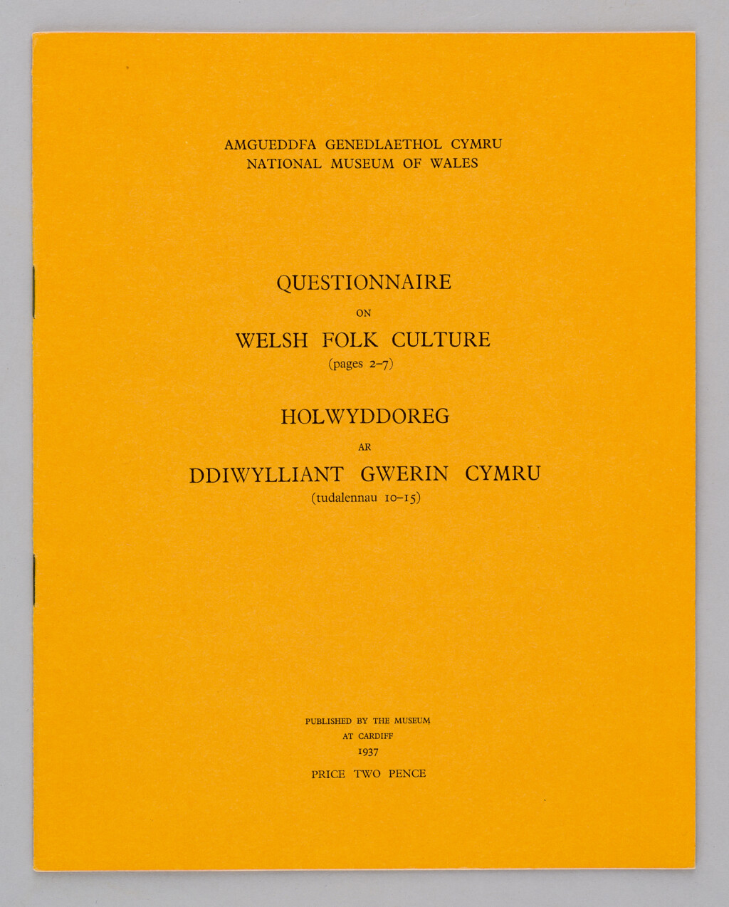 Mustard coloured front page of the Questionnaire on Folk Culture. Title printed in Welsh and English in black ink. 