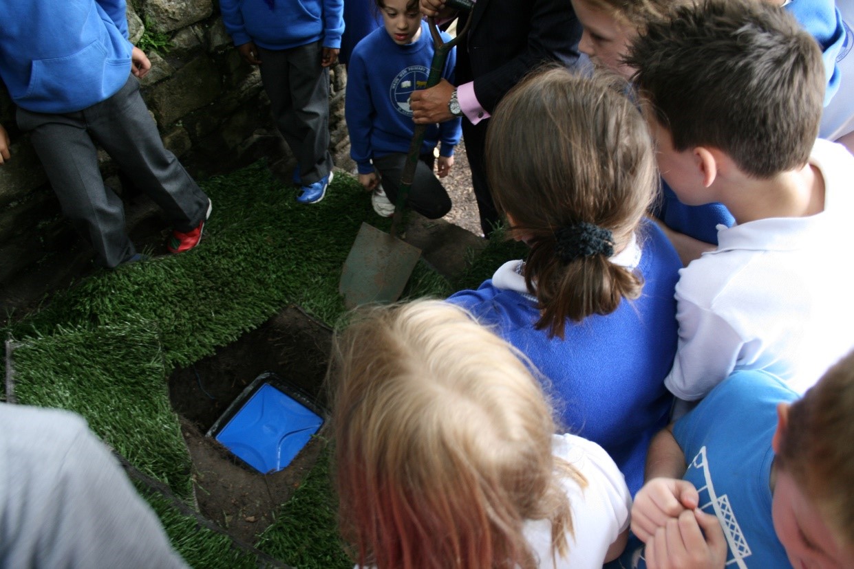 Chris Coleman and Waun Wen School children with buried time capsule
