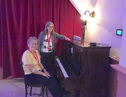 Oakdale two women by a piano