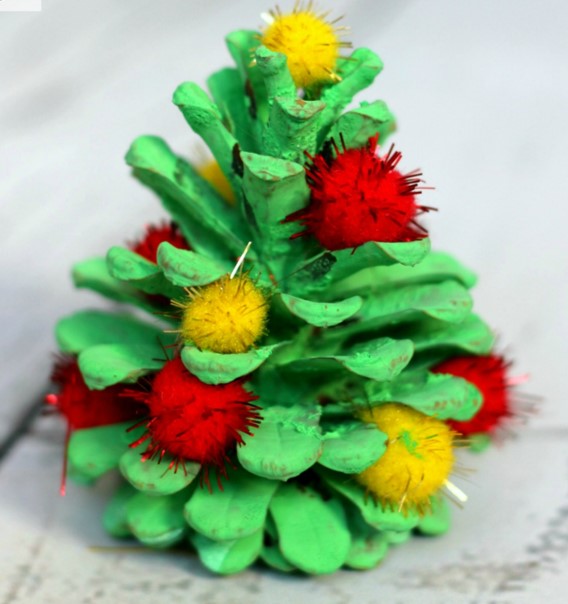 Photo of a pinecone painted to look like a christmas tree