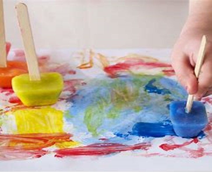 Photo of a child using ice cube paints