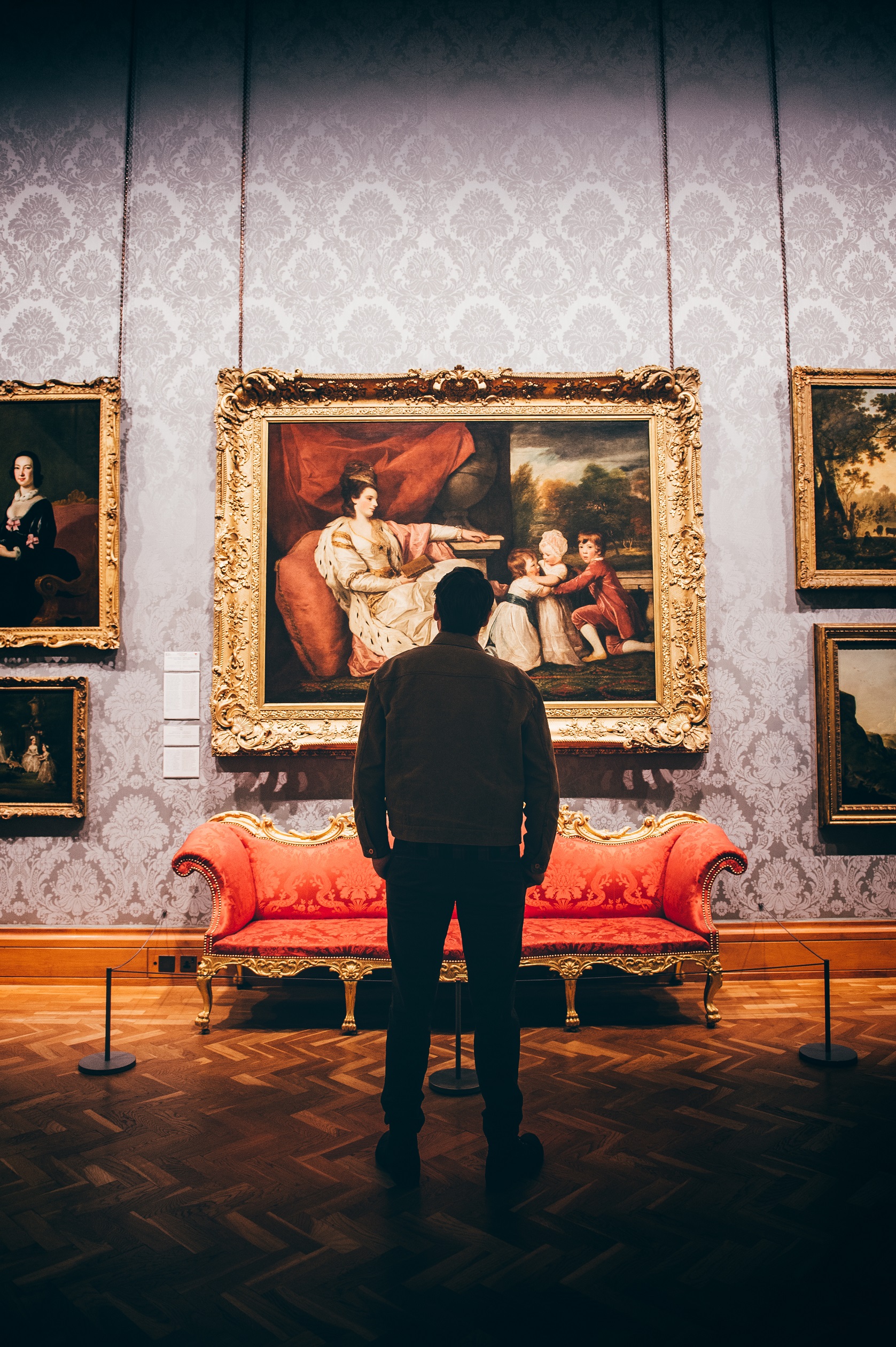A young man admiring a piece of historic artwork