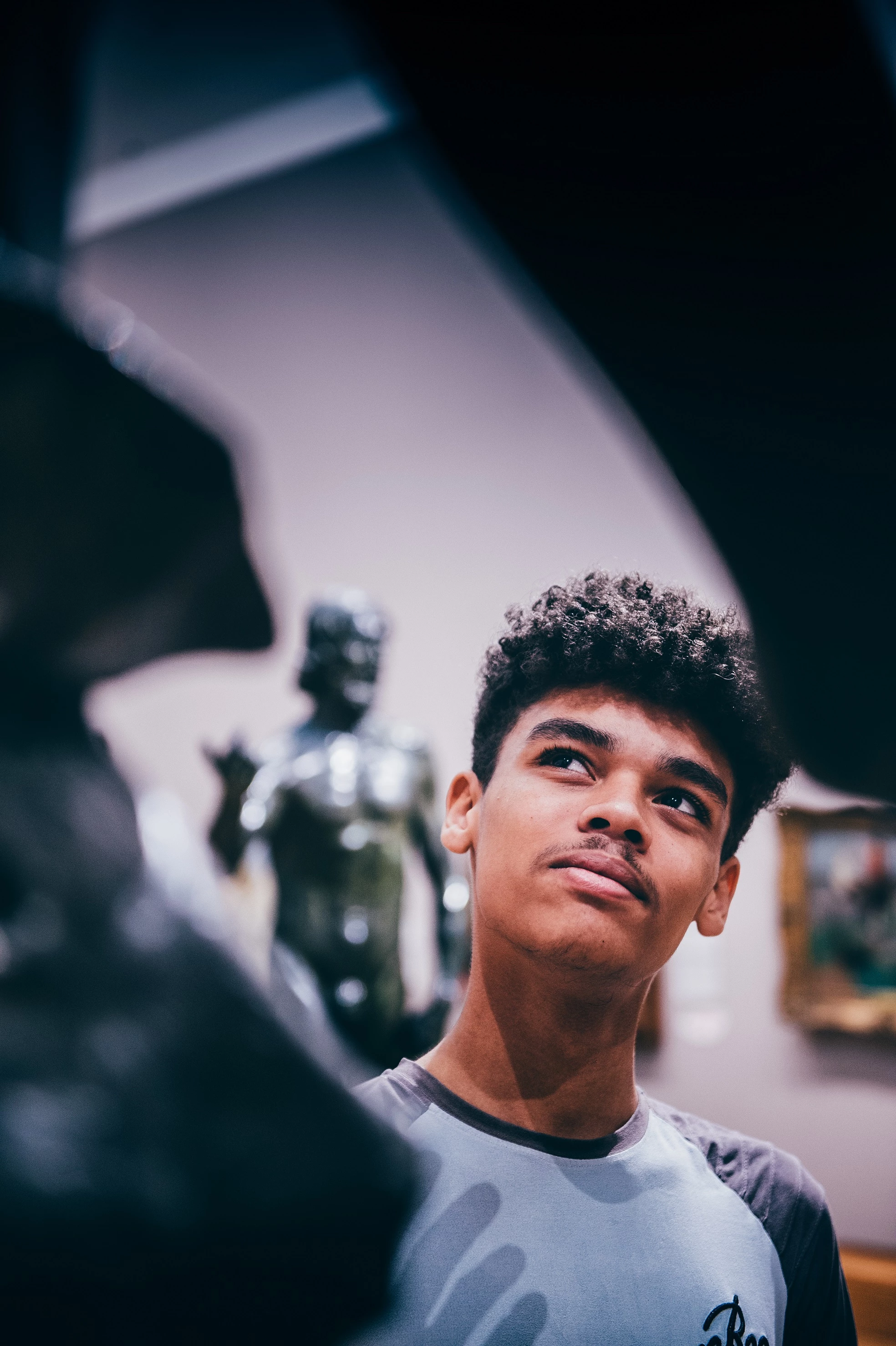 A young man admiring a scultpure
