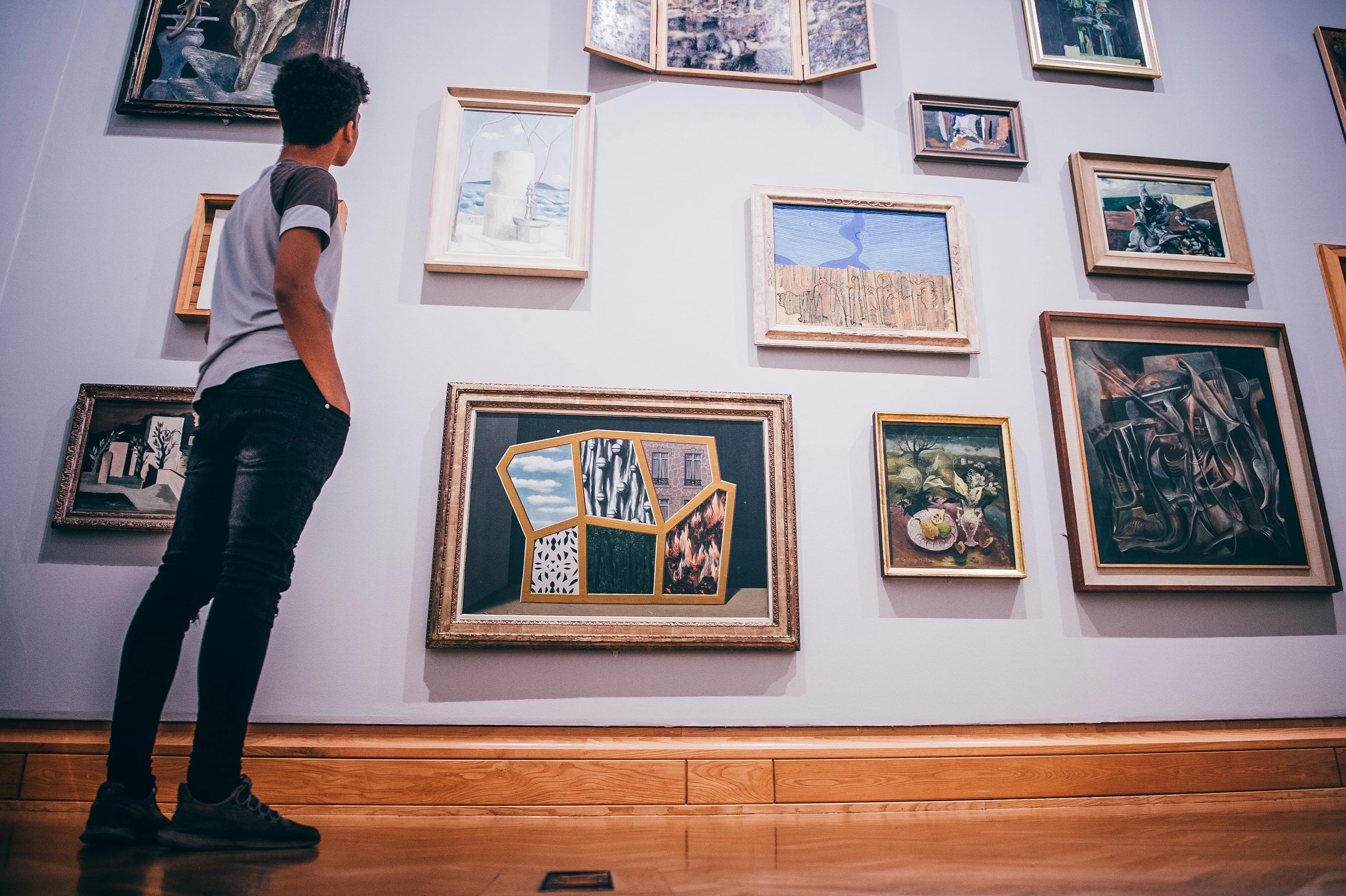 A young man admiring a piece of modern artwork