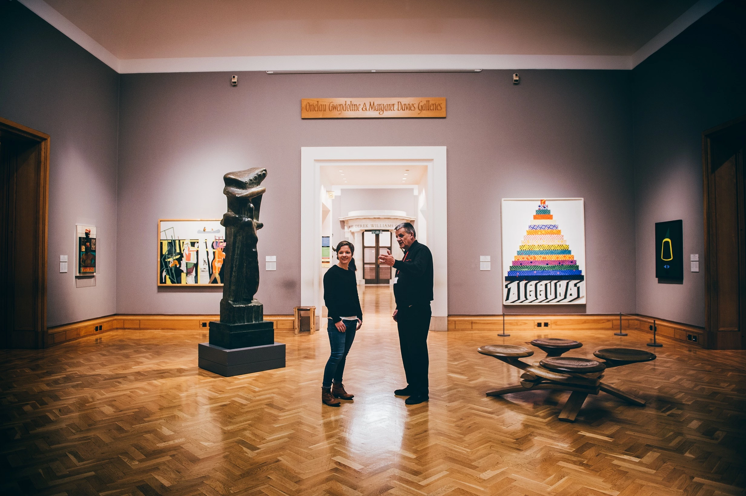 Two people stand in the Impressionist and Modern art gallery