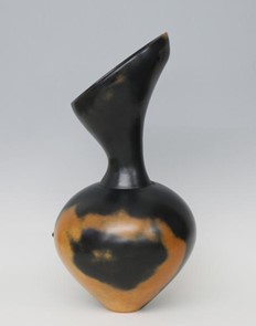 Brown and black asymmetric terracotta vase 