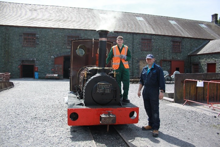 Una the steam engine and 2 people at National Slate Museum