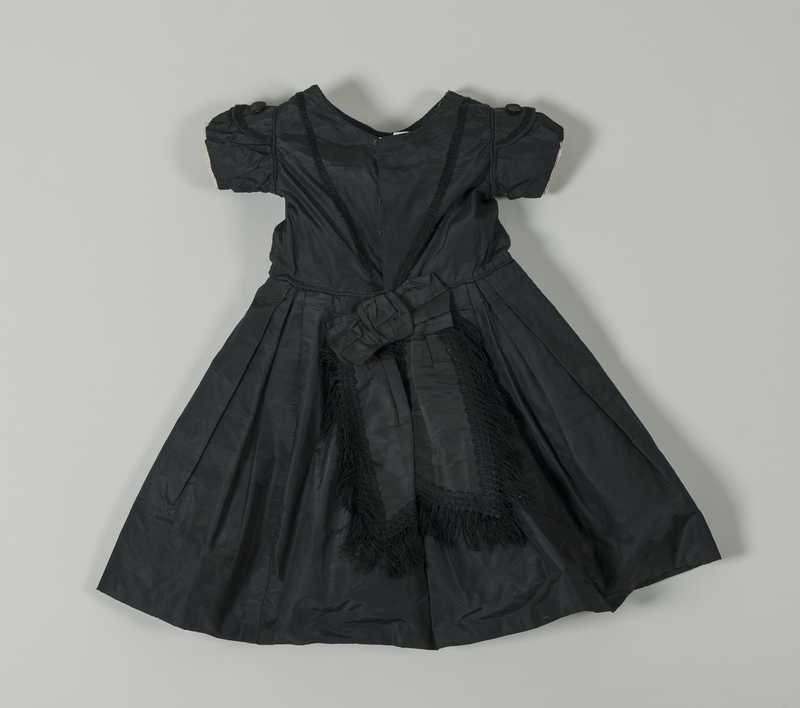 Photograph of a child’s mourning outfit