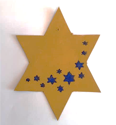 Photo of a star made from card and painted gold