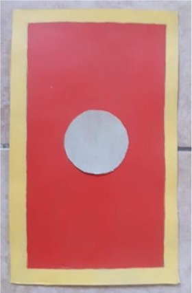 Photo of a child's Roman shield made from card and paper