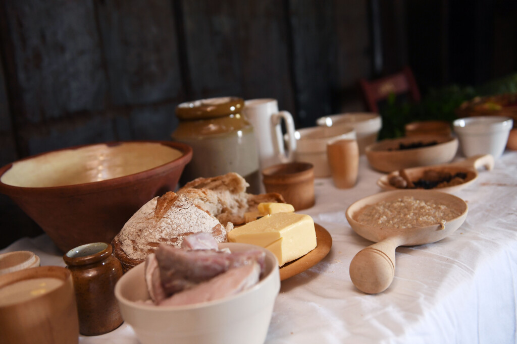 Table of ingredients with ceramic and wooden crockery 