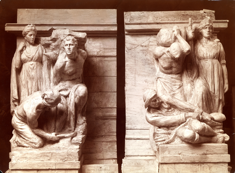 Sepia photograph of two plaster models for sculptures on the left and right corners of a building; each of the sculptures has three human figures