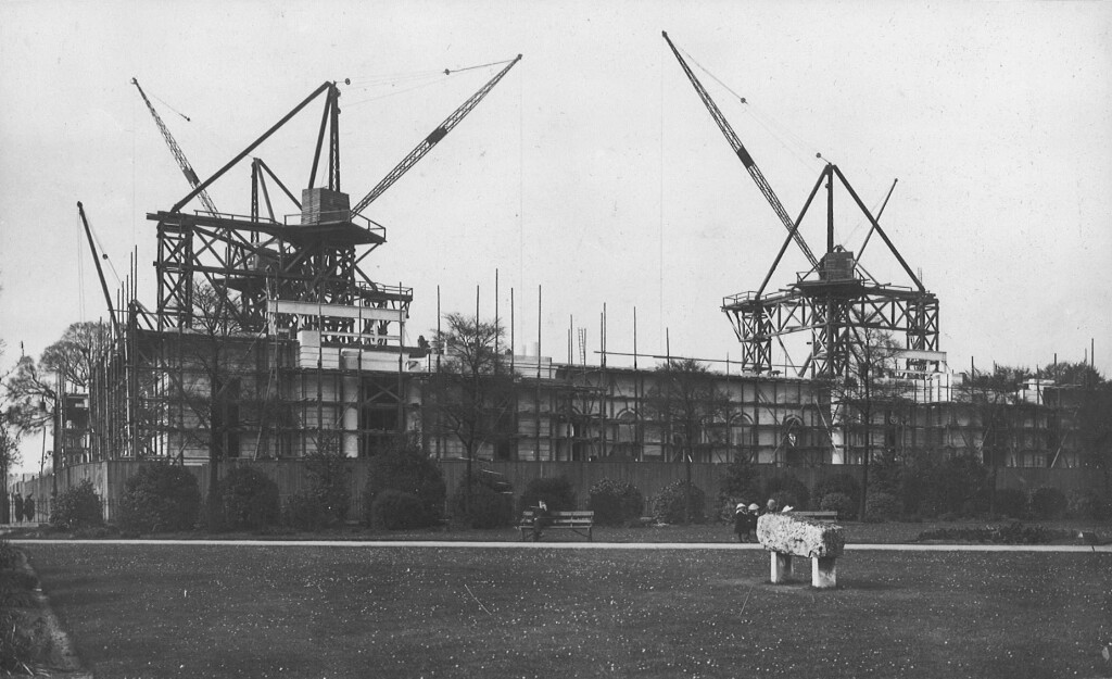 Photograph of the Museum under construction covered in scaffolding and cranes
