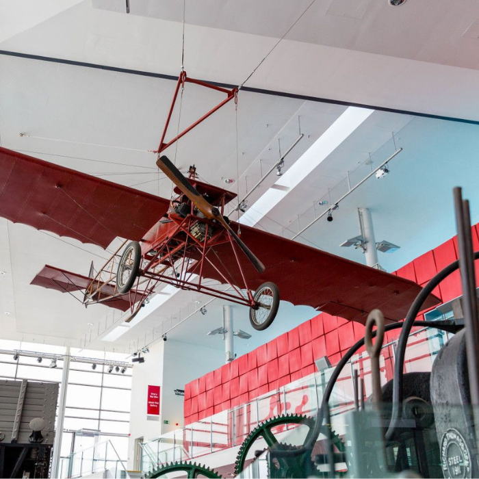 Vintage aeroplane hanging from a ceiling
