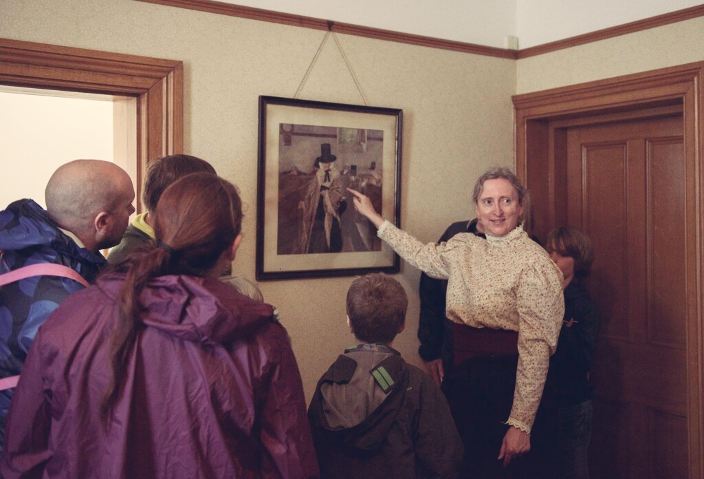 An actress in residence tells visitors about important things in the Chief Engineer's House