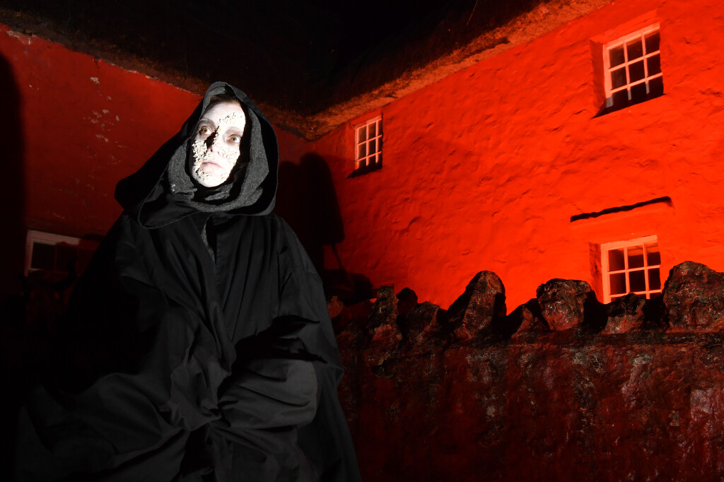 A woman dressed as a pox ghost standing outside Kennixton farmhouse 