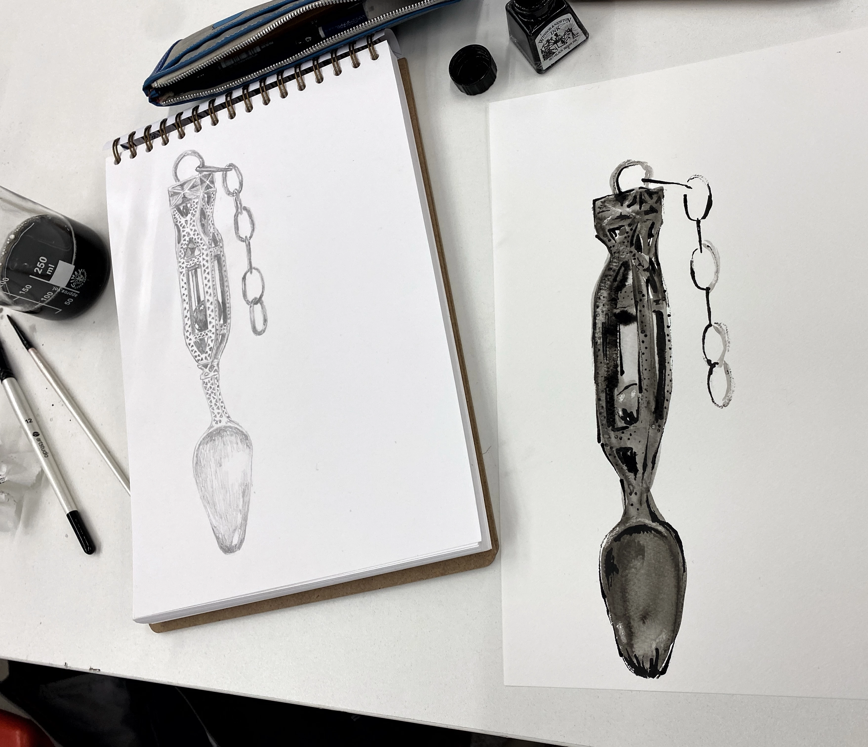 A black and white sketched drawing of a love spoon from the Gweithdy Gallery at St Fagans National Museum of History. 