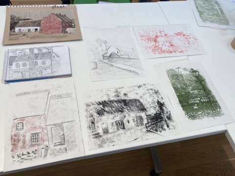 A collection of mono prints in different colours of some of the historic buildings at St Fagans drawn by members of the Sketching group. 