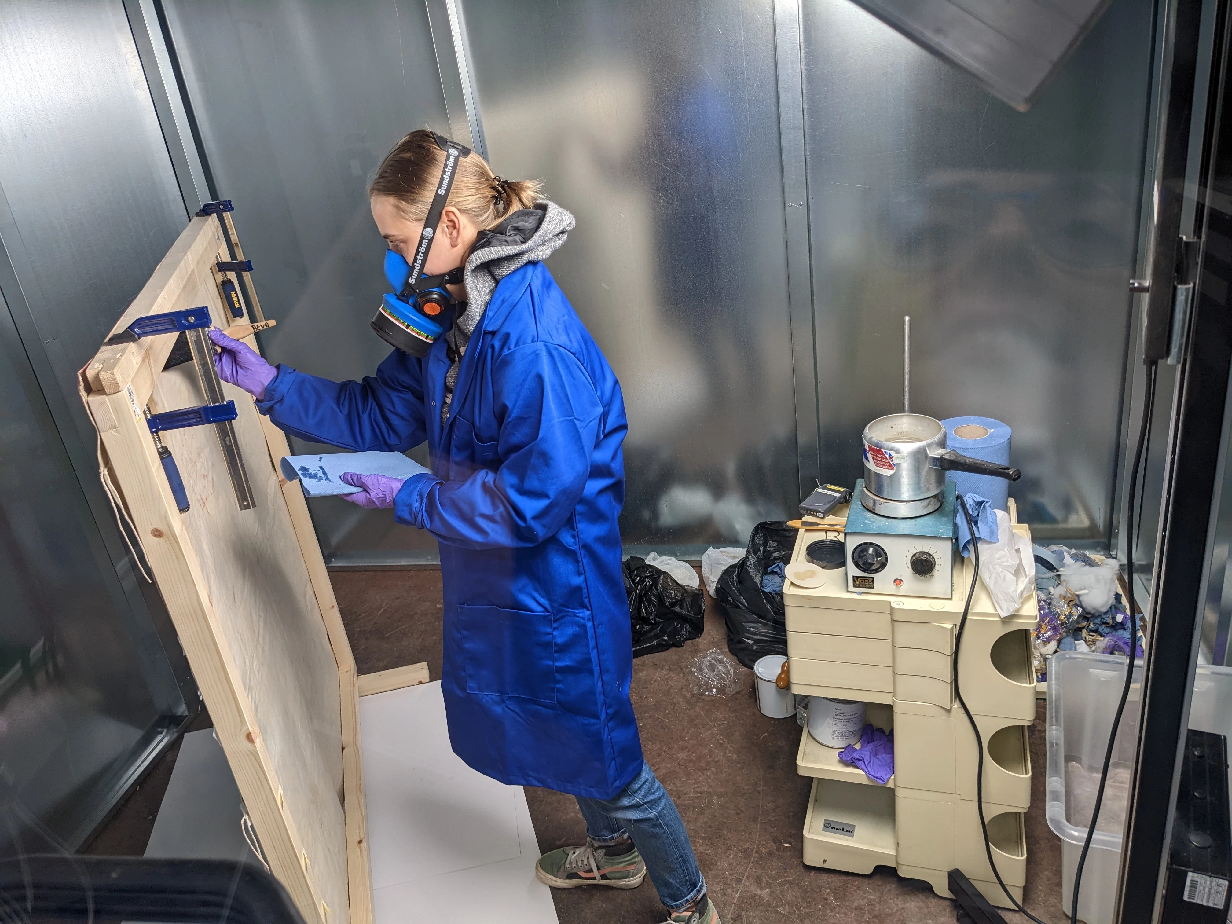 Applying adhesive to the back of the banner 