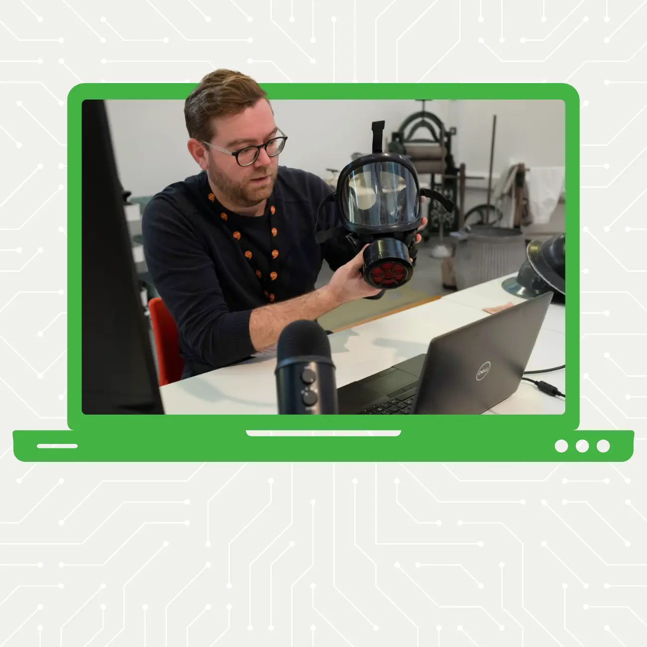 Man holding a gas mask up to a camera