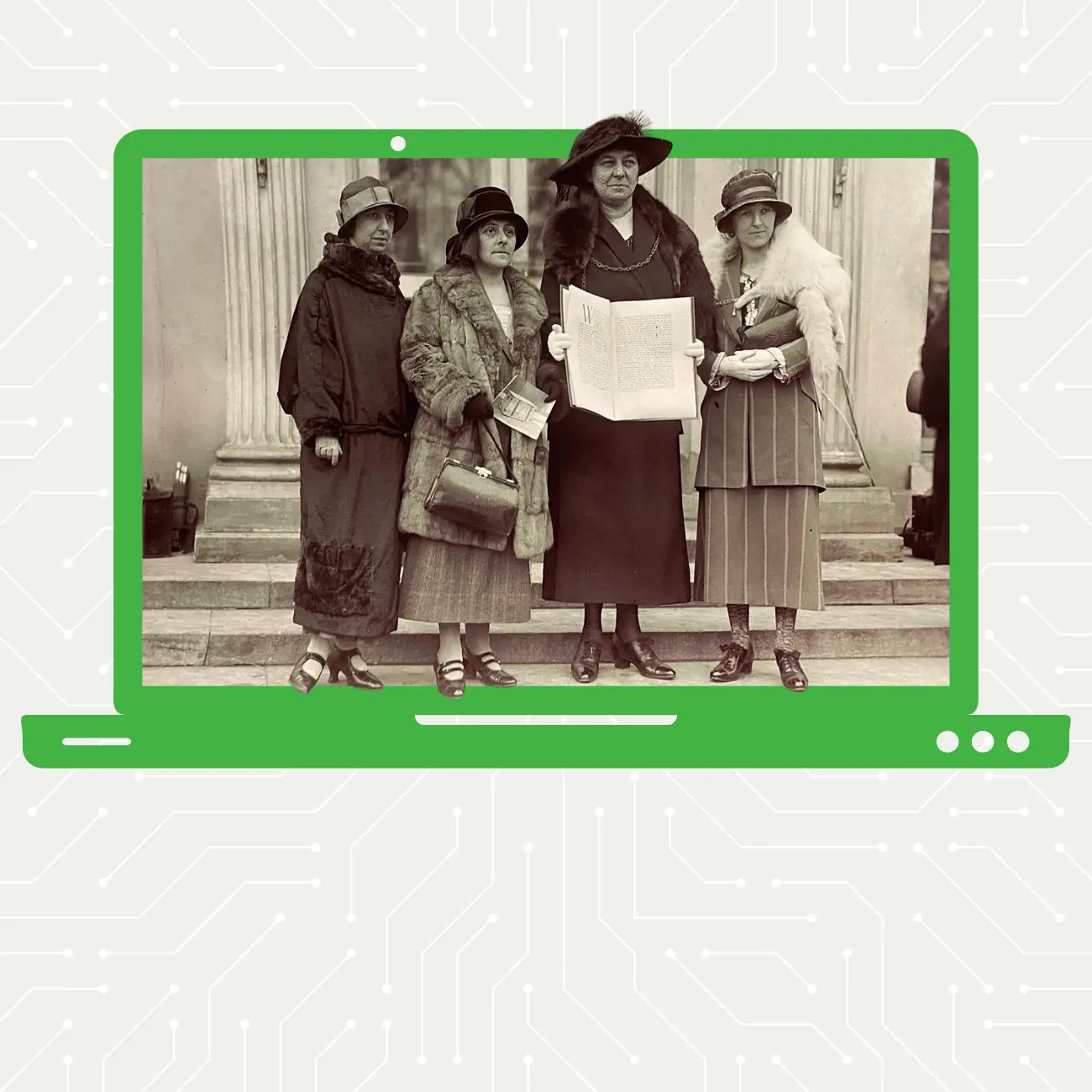 Black and white image of four women holding a book containing signatures