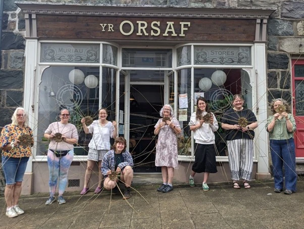 Fig 7. An early stage in Eirian’s workshop: us holding the spidery spines of our baskets!