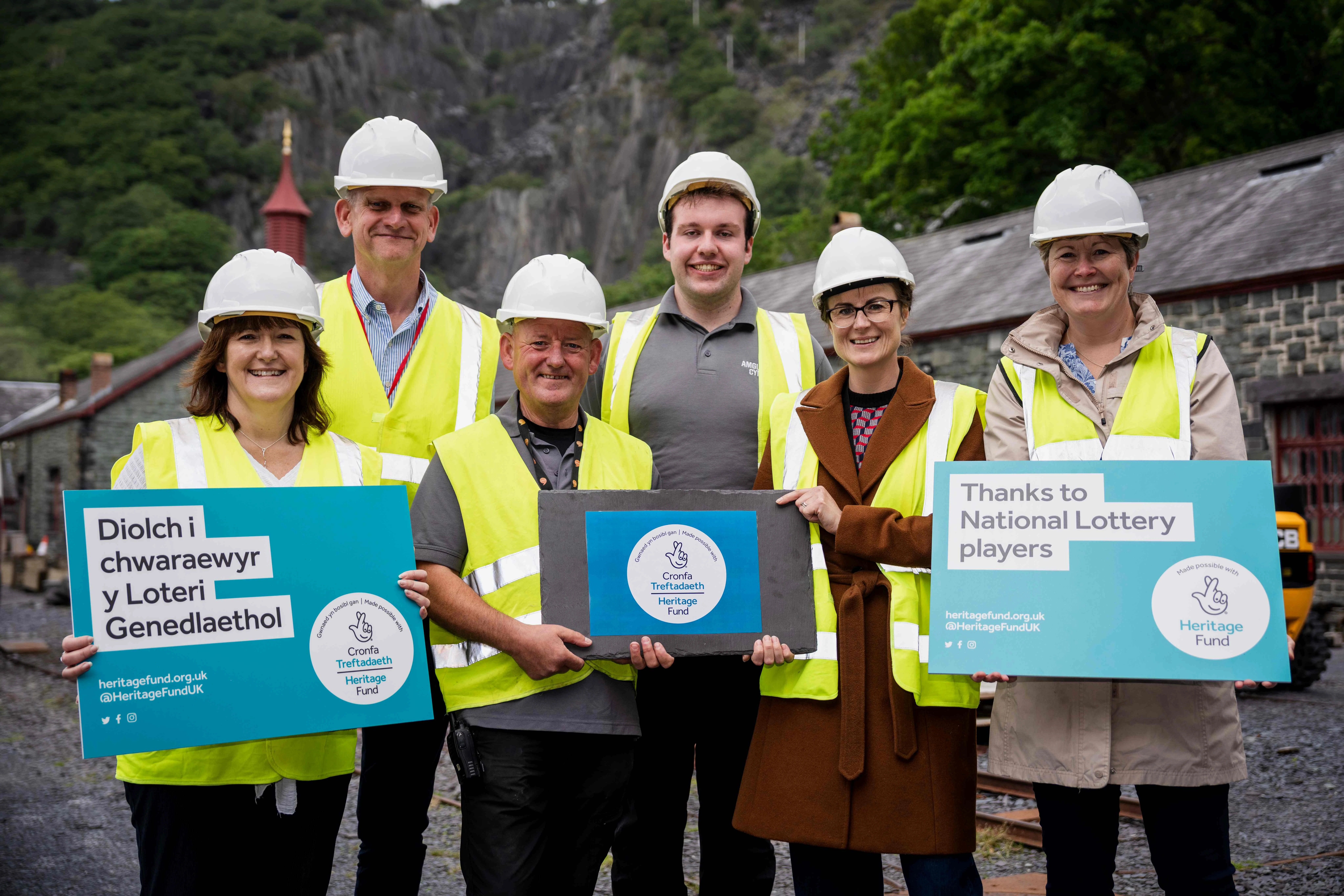 a group of people holding logos