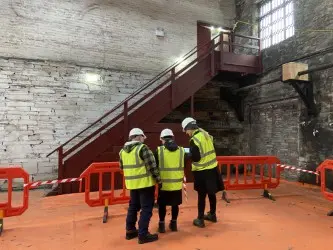 Volunteers looking at the Foundry stairs in the National Slate Museum. 