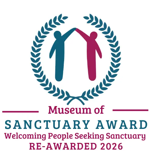 Two silhouettes, one green one red are high fiving each other in the middle of a crest, the text states that the Museum of Sanctuary award has been re-awarded