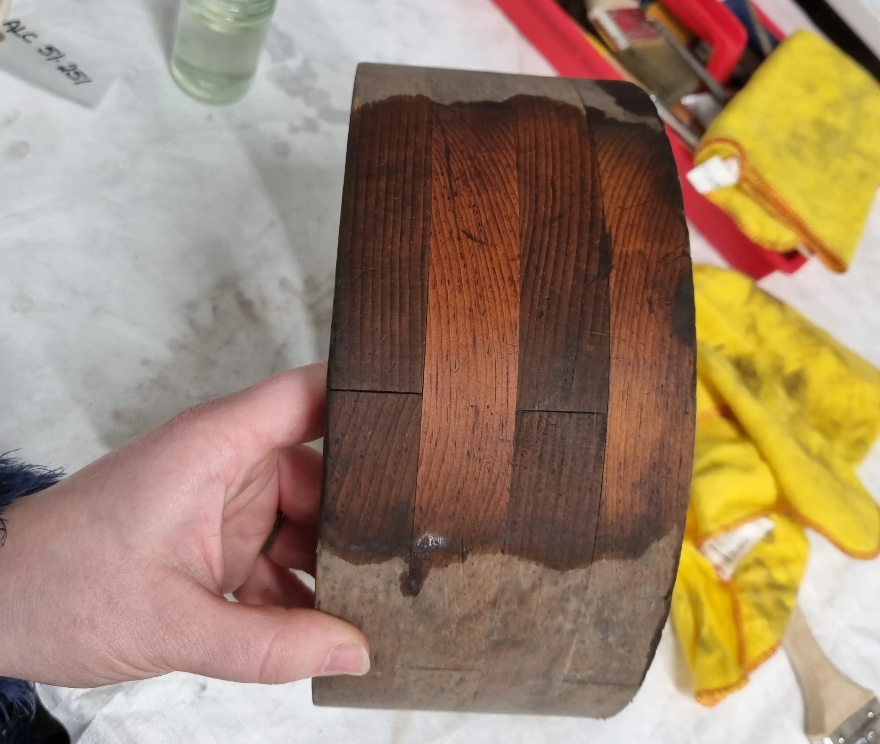 A wooden pattern showing areas which have been conserved and areas which have not