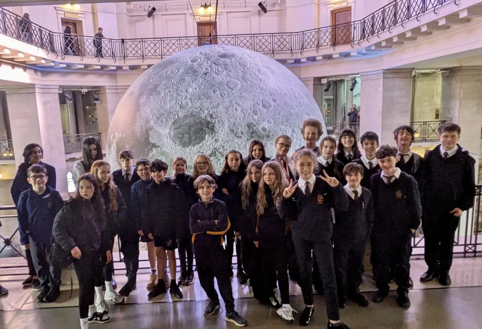 Pupils from Stanwell School with the Museum of the Moon sculpture