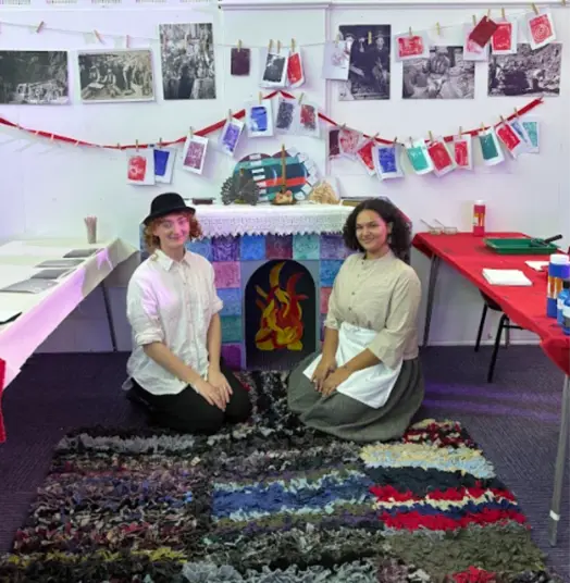 Iza and Cara with their final product and the work of those who took pART
