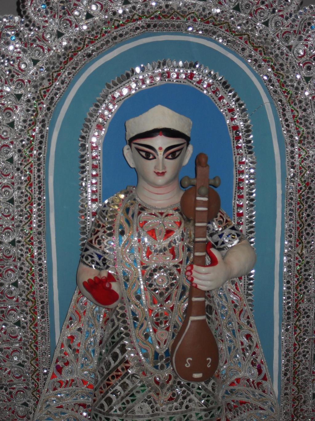 Sarasvati, Goddess of Knowledge and the Arts, holding her instrument, the veena.