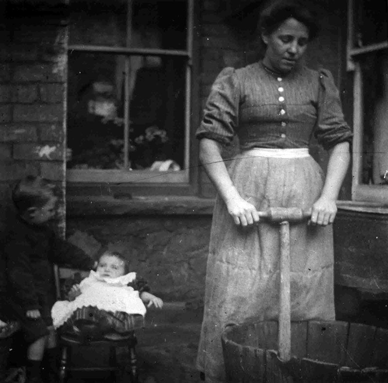 Mrs George, Pontypool, washing with a dolly tub, about 1900. Photographs of domestic work during this period are rare.